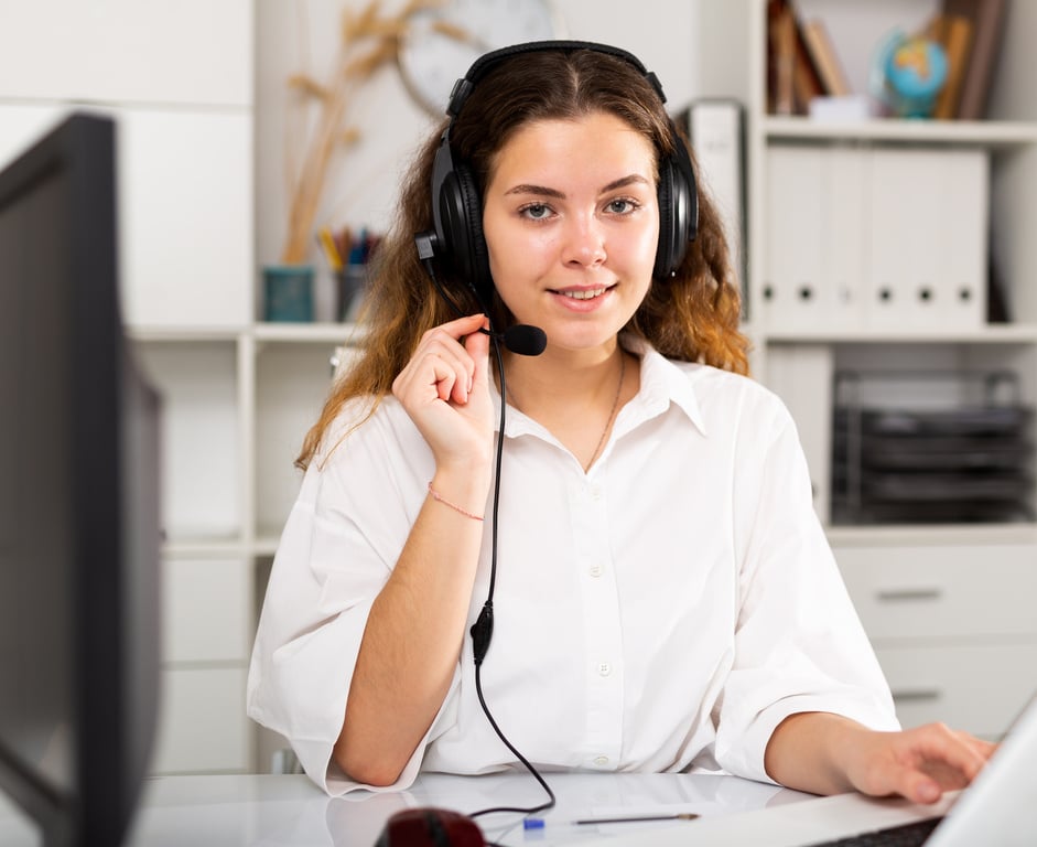 Young positive woman customer support phone operator